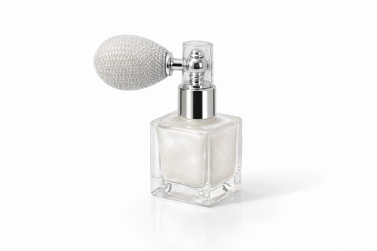 Luxury pearl white body shimmer spray bottle with vintage atomizer photographed on a clean white background
