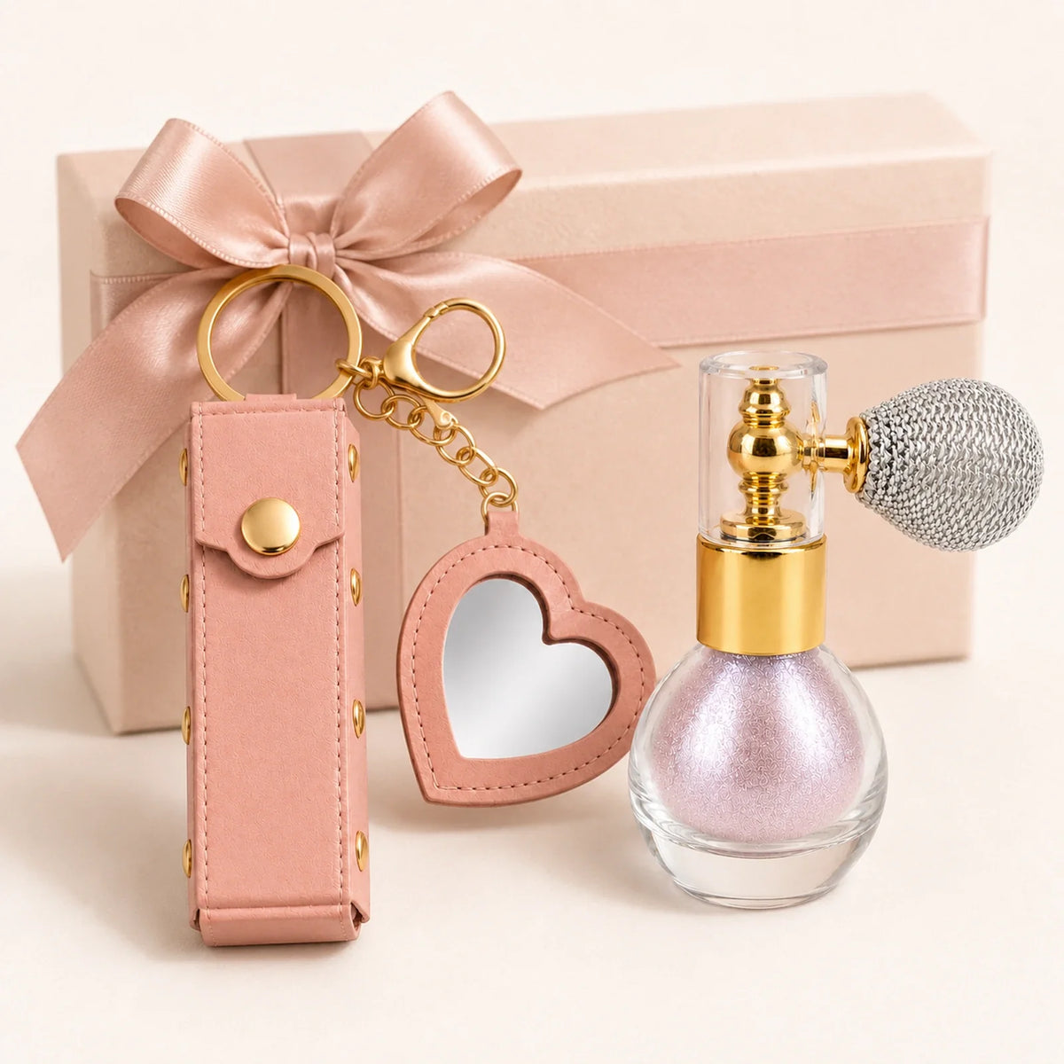Birthday Glow Gift Set gift-ready presentation with soft pink shimmer atomizer and heart mirror lipstick holder keychain