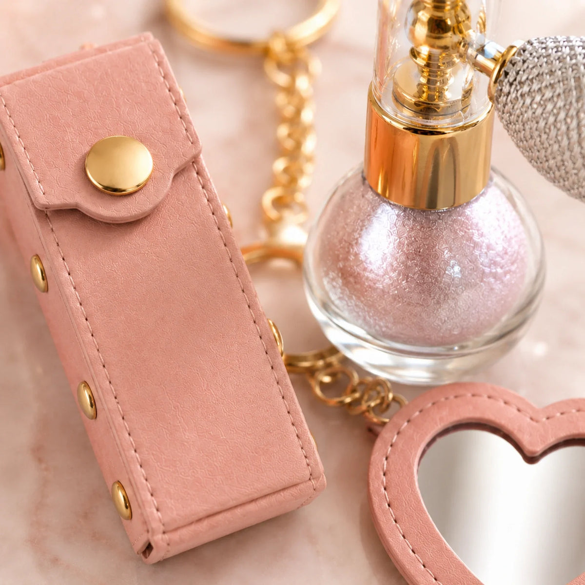 Birthday Glow Gift Set lifestyle image showing subtle pink body shimmer with heart mirror lipstick holder keychain