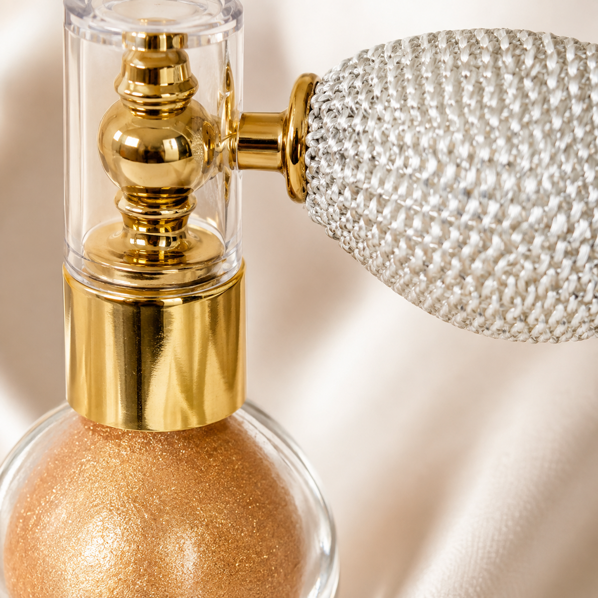 Close-up detail of Champagne Rose Gold Body and Hair Shimmer Powder atomizer