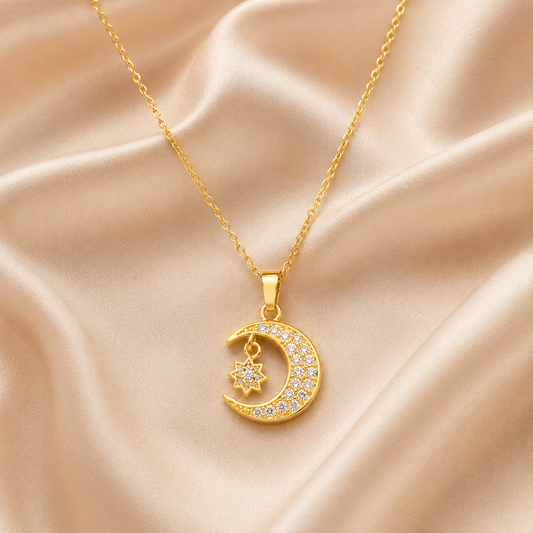 Gold Moon & Star Pendant Necklace on champagne satin