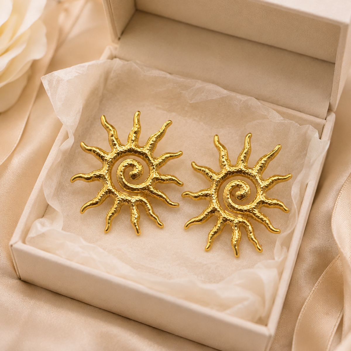 Gold Sun Statement Earring shown in hand for scale