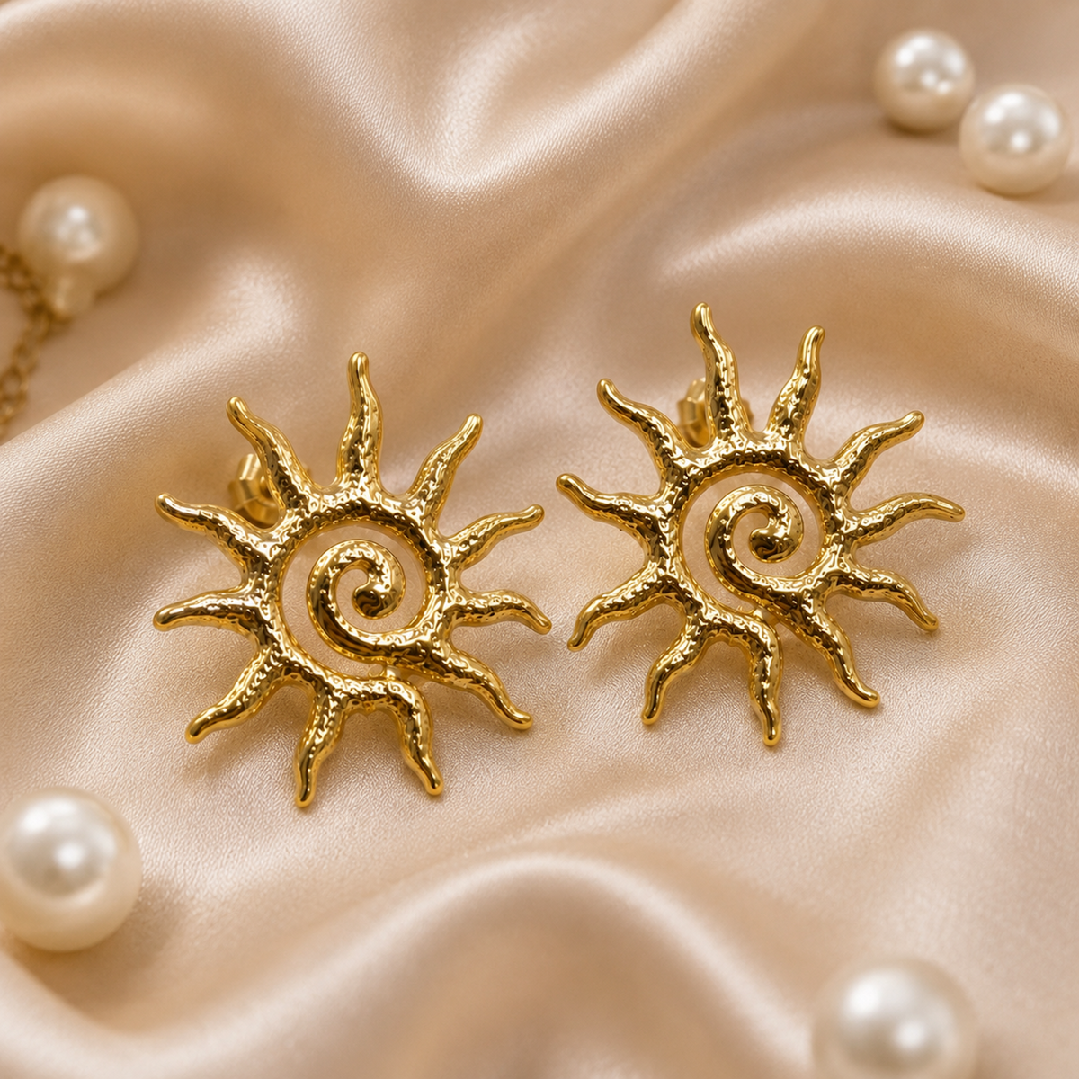 Macro detail of hammered gold sun spiral earring