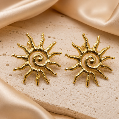 Gold Sun Statement Earrings presented in an ivory jewelry box