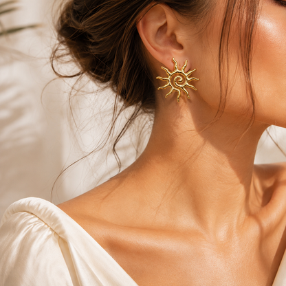 Gold Sun Statement Earring worn in a warm lifestyle portrait