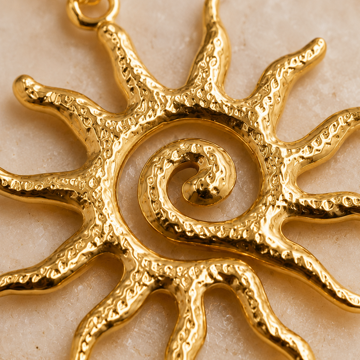 Gold Sun Pendant Necklace close-up texture detail