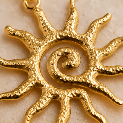 Gold Sun Pendant Necklace close-up texture detail