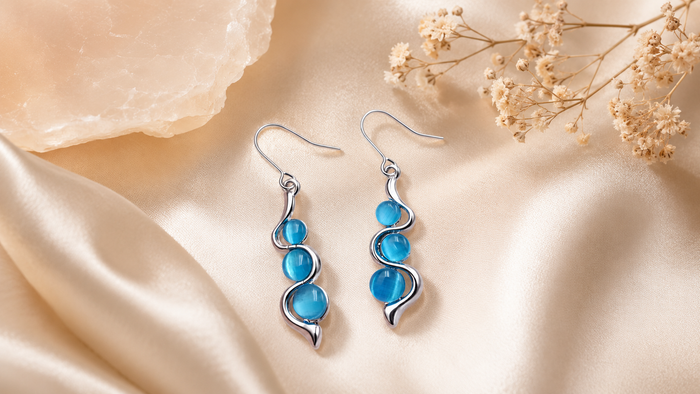 Blue Wave Dangle Earrings styled as feminine statement jewelry