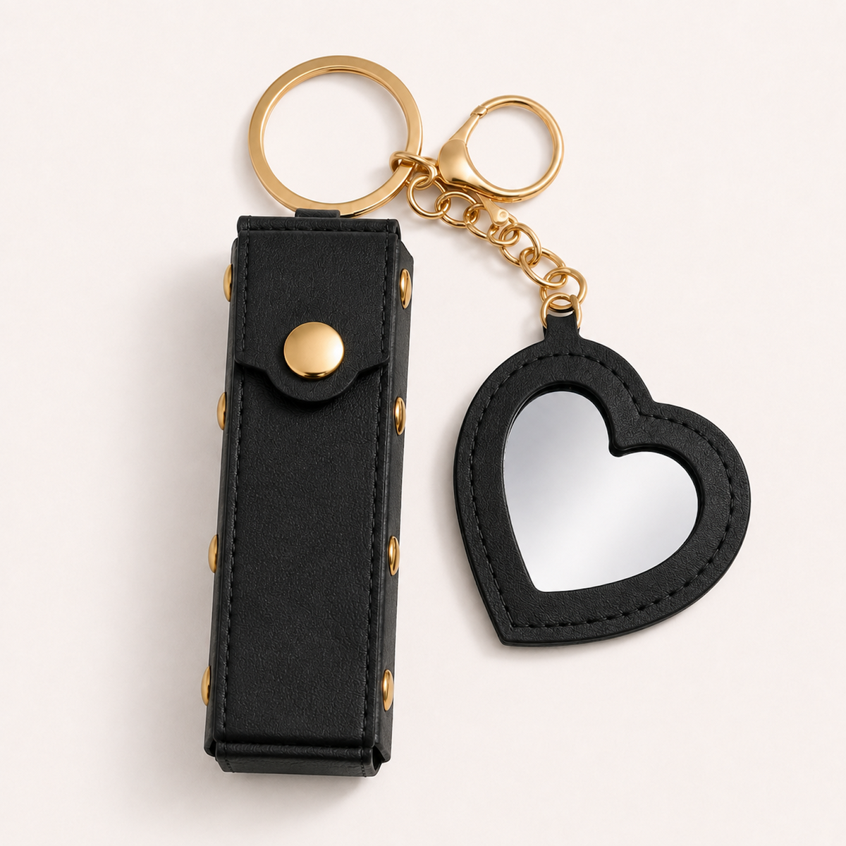 Green Lipstick Holder and Mini Heart Mirror Keychain with gold hardware on a clean light background