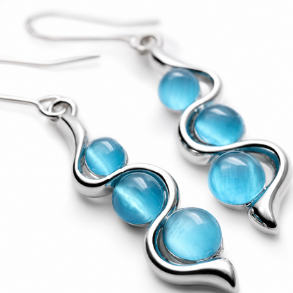 Blue Wave Dangle Earrings clean product view on a light neutral surface