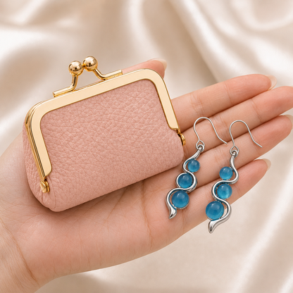 Blue Wave Earrings and pink mini coin purse shown in hand for scale