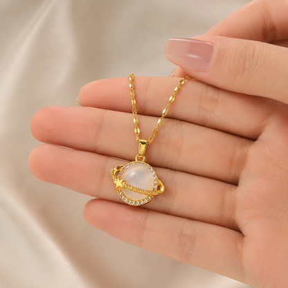 Gold Celestial Planet Pendant Necklace shown with scale reference