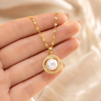 Gold Pearl Circle Pendant Necklace shown with scale reference