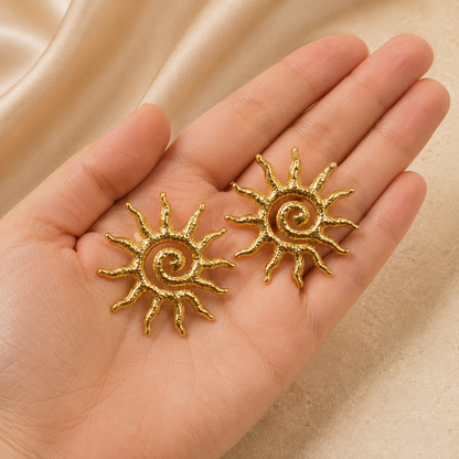Golden Sun Earrings shown with scale reference