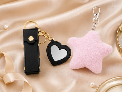Luxe Little Extras Gift Set with black mini heart mirror keychain and pink star pom pom keychain variant