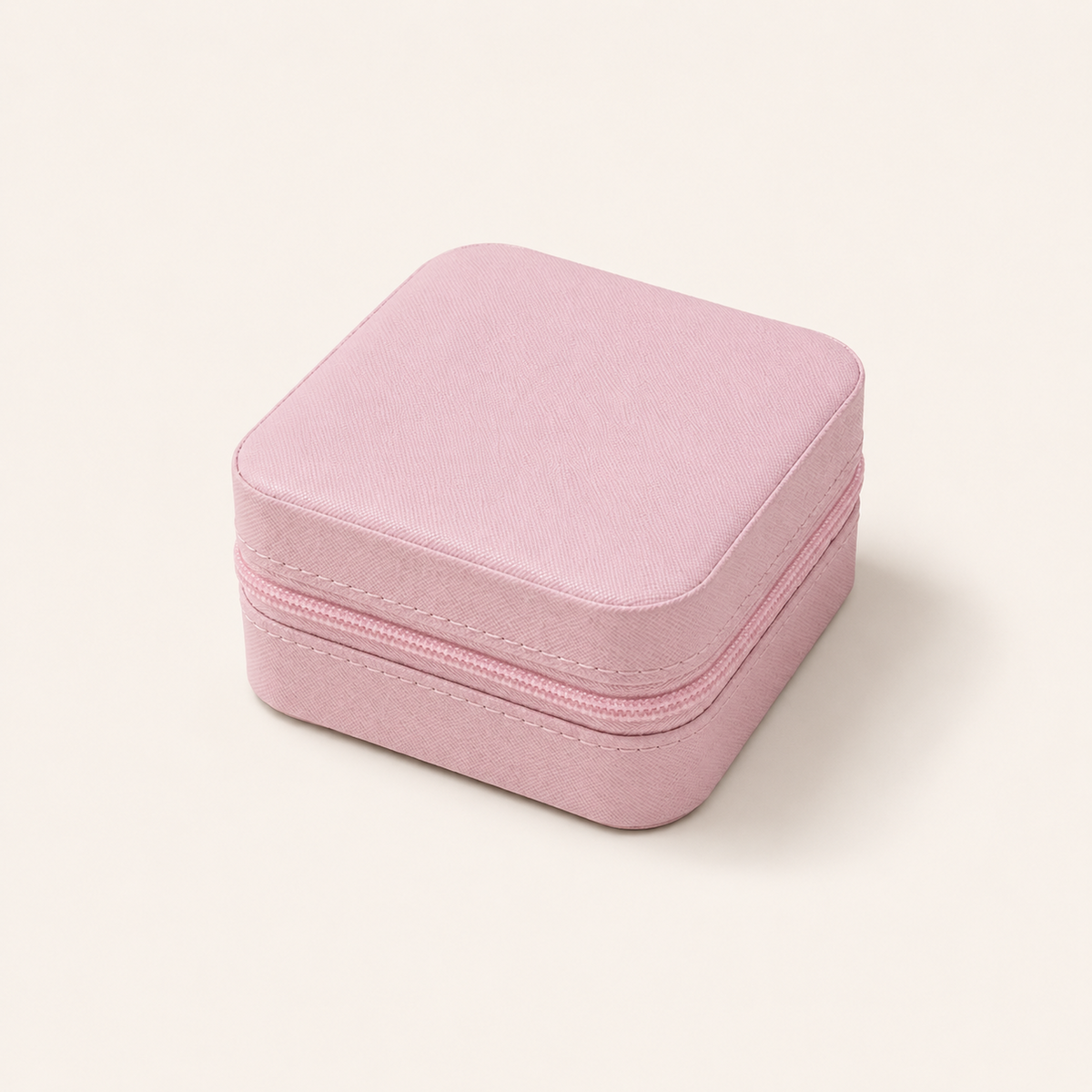 Pink Mini Travel Jewelry Box closed with textured exterior and zipper