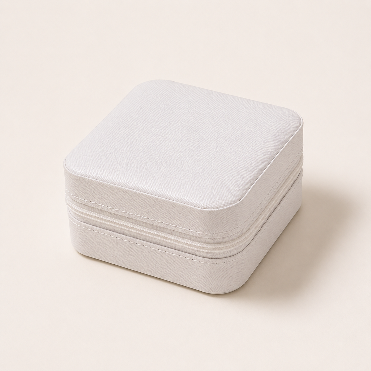 White Mini Travel Jewelry Box closed with textured exterior and zipper
