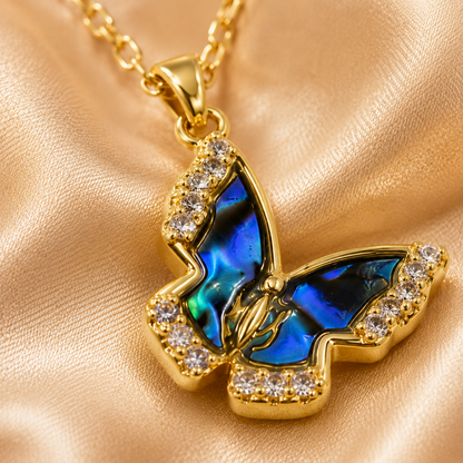 Close-up detail of Natural Shell Butterfly Pendant Necklace with blue shell inlay and crystals