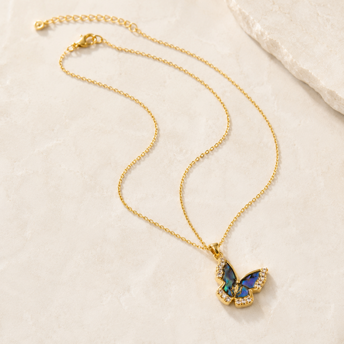 Natural Shell Butterfly Pendant Necklace with iridescent blue shell and crystal accents