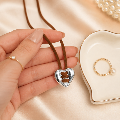 Vintage Silver Heart Leather Necklace shown with scale reference