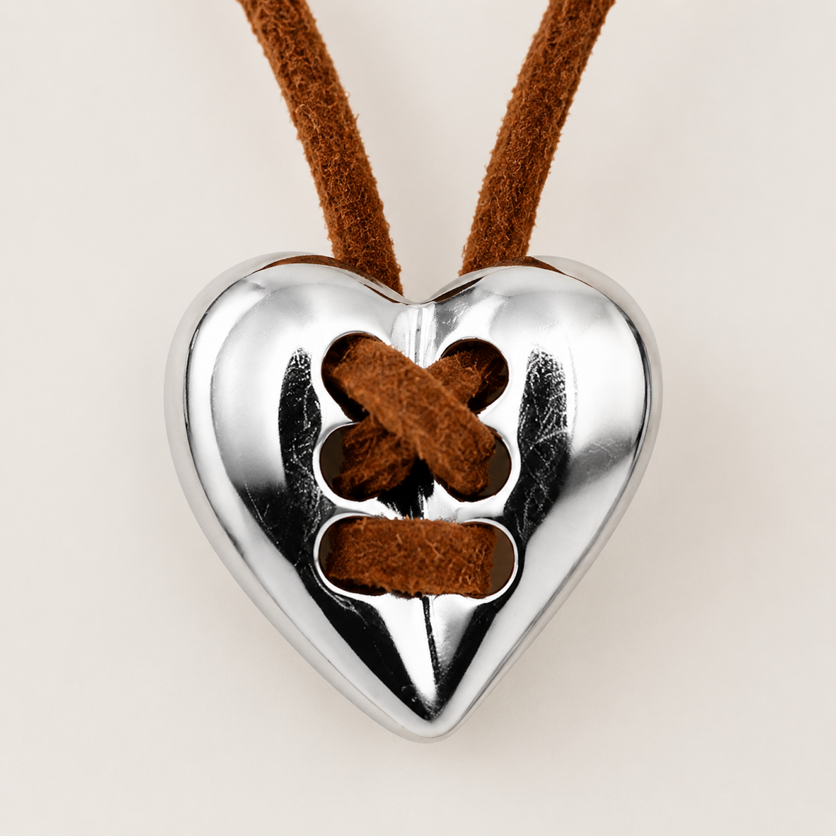 Close-up detail of Vintage Silver Heart Leather Necklace pendant and leather cord